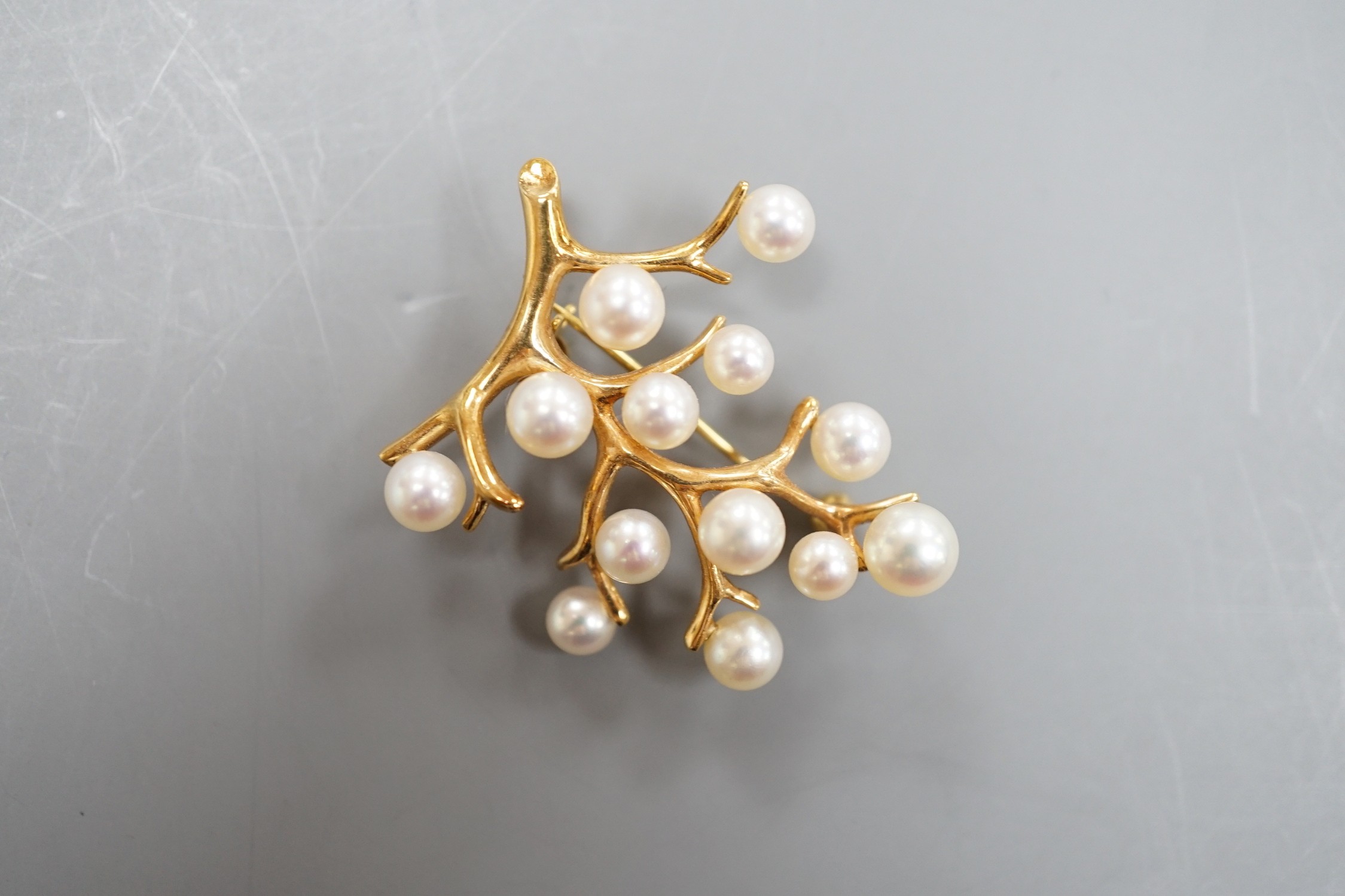 A Mikimoto 14k yellow metal and cultured pearl set cluster spray brooch, 34mm, gross weight 5.9 grams.